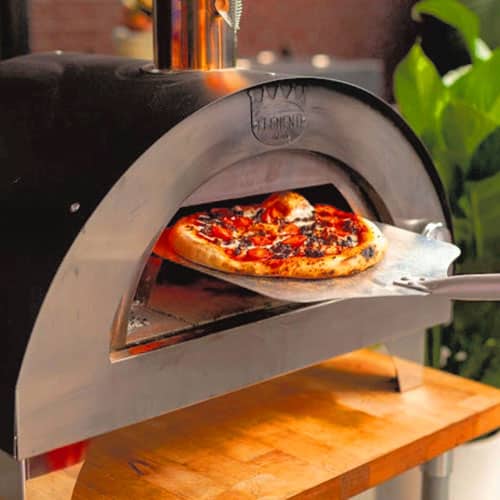 Clementino portable wood fired pizza oven cooking pizza