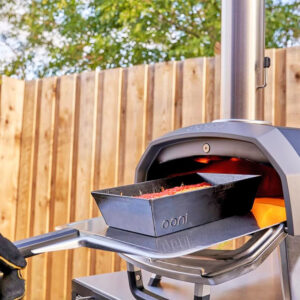 Ooni Pizza Peel holding detroit-style pizza pan