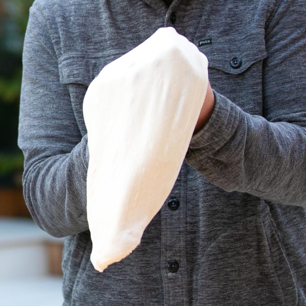 Stretching out pizza dough